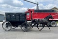 Amish horse and buggy in traffic in shipshewana Royalty Free Stock Photo