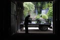 Amish Man Silouetted in his His Barn Door Royalty Free Stock Photo