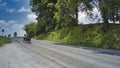 Amish Open Horse and Buggy Approaching With a Couple and Daughter in it Royalty Free Stock Photo