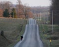 Amish woman on a wavy road