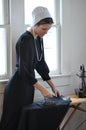 Amish Young Woman Ironing Royalty Free Stock Photo