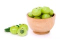 Amla fruit or gooseberry berry on white.