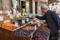 AMMAN, JORDAN - MAY 18, 2019: Spices, nuts and sweets shop on the market in Amman downtown, Jordan. Choice of Arabic spices on the