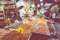 AMMAN, JORDAN - MAY 18, 2019: Spices, nuts and sweets shop on the market in Amman downtown, Jordan. Choice of Arabic spices on the