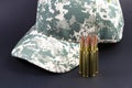 Ammo and a camo hat Royalty Free Stock Photo
