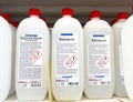 Ammonia and hydrochloric acid bottles on store shelf with warning labels Royalty Free Stock Photo