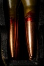 Ammunition caliber 5.45 for a automatic rifle in a magazine, macro photography, small scratches on the bullets are visible