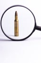Ammunition on a white background. View through a magnifier. Isolated. Close up. Weapons. Royalty Free Stock Photo