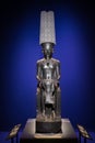 Amon god statue protecting Tutankhamun