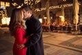 Amorous couple kissing on Christmastime Royalty Free Stock Photo