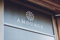 Amouage brend sign on city street. Signboard logo of international luxury fragrance brand Amouage store, shop, mall, boutique. Royalty Free Stock Photo