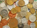 Amount of old money coins of different countries on dollar background