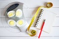 The Amount Of Protein, Calories, Carbohydrates And Fats In Food. Cut Egg On The Kitchen Scales