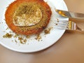 Amous Turkish delicious dessert hot kunefe served with pistachio powder and ice cream