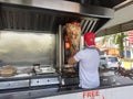 Kebab or shawarma is sold by hawkers in small roadside shops as a takeaway dish. Royalty Free Stock Photo