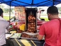 Kebab or shawarma is sold by hawkers in small roadside shops as a takeaway dish. Royalty Free Stock Photo