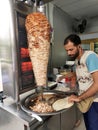 Kebab or shawarma is sold by hawkers in small roadside shops as a takeaway dish. Royalty Free Stock Photo