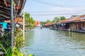 Amphawa floating market with traditional Mae Klong river side village