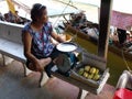 A woman sells mangoes at Amphawa Floating Market Royalty Free Stock Photo