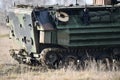 Amphibious tank caterpillars are seen on a field