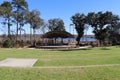 Amphitheater with green grass, blue sky, and water background Royalty Free Stock Photo