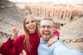 Amphitheater in Hierapolis ancient city Pamukkale Turkey Happy Couple Tourist taking selfie photo Royalty Free Stock Photo