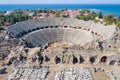 Amphitheater in Side. Tyukhe Temple. Agora. Ruins of the ancient city. Turkey. Manavgat. Antalya. Shooting from a drone. View from Royalty Free Stock Photo