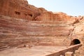 Amphitheatre of the lost ancient city of Petra with seats carved into the rocks, the Rose red City, Jordan Royalty Free Stock Photo