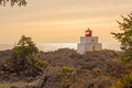 Amphitrite Point Lighthouse at sunset, located in Ucluelet, Vancouver Island Royalty Free Stock Photo