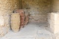 Amphoras in cellar in ruins of palace Knossos Royalty Free Stock Photo