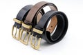 ample of several colors, black, brown, leather men`s belt with metal shiny buckle handmade Royalty Free Stock Photo