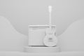 Amplifier with acoustic guitar on cylinder podium with step on monochrome Royalty Free Stock Photo