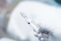Ampoule with drug in workers hand Royalty Free Stock Photo