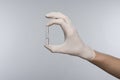 Ampoule hand in glove Royalty Free Stock Photo