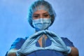 Ampoule with medicine, vaccine in hands of doctor in protective mask, gloves and uniform, closeup. Coronavirus disease COVID-19