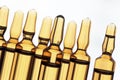 Ampoules of glass with vaccine photographed in white light. Royalty Free Stock Photo