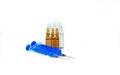 Ampoules with liquid and syringes on a white background. Isolate. Healthy lifestyle concept Royalty Free Stock Photo