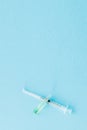 Ampoules and syringes close up on blue background. Copy space Royalty Free Stock Photo