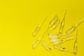 Ampoules on a yellow background.