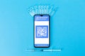 Ampules with vaccines, syringe and smartphone with electronic Immunity passport. Blue background. Concept of vaccination from Royalty Free Stock Photo