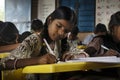 AMRAVATI, MAHARASHTRA, INDIA, August 2018, Girl writing at her desk at primary school at Ghuti Village, Dharni Taluka