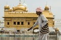 One poor sikh pilgrim passing Golden temple