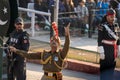 Indian Border Security Force man prepares to lower flags at Wagah Border Closing Ceremony