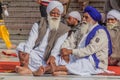 AMRITSAR, INDIA - JANUARY 26, 2017: Sikh devotees in the Golden Temple Harmandir Sahib in Amritsar, Punjab, Ind