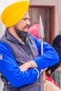 AMRITSAR, INDIA - JANUARY 26, 2017: Sikh warrior with a spear on a guard in the Golden Temple Harmandir Sahib in Amritsar, Punjab