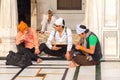 Amritsar, India - November 21, 2011: The Sikh pilgrims in the Golden Temple complex. Amritsar, Punjab, India Royalty Free Stock Photo