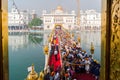 Amritsar, India - November 21, 2011: Sikh pilgrims stand in line at the bridge to get to the Golden Temple. Amritsar, Punjab, Royalty Free Stock Photo