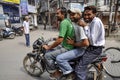 Amritsar, India, september 4, 2010: Young men on a motorcykle, smiling, India.