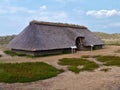 Amrum, Germany - May 28th, 2016 - Reconstruction of a prehistoric iron age thatched-roof turf house on the island of Amrum