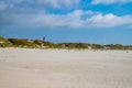 Amrum lighthouse behind dunes on the beach of SÃÂ¼ddorf